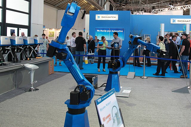 Teach pendant de robot industrial mostrando interfaz de programación